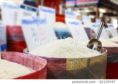White kernel fragrant rice in the sack,Raw grain,Khao Hom Mali Jasmine Husked in the market or department store,Milled or Parboiled rice,Thai aromatic rice,dry food,diet,nutrition,healthy food concept 92120547