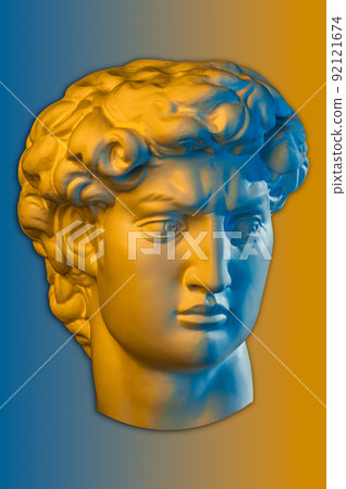 Gypsum copy of head statue David in bright neon colors for artists on a color background. Face famous sculpture youth of David by Michelangelo. Template design for dj, fashion, poster, zine, collage. 92121674