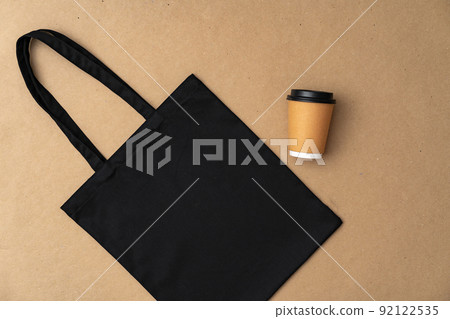 Textile shopping bag and coffee cup flat lay 92122535