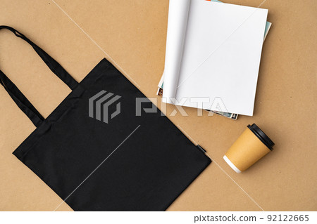 Textile shopping bag and coffee cup flat lay 92122665
