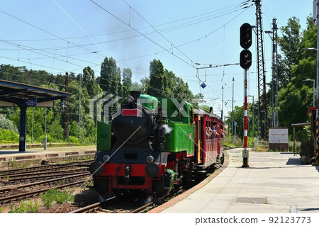 Beautiful old Czech train with steam locomotive. Concept for retro, travel and train travel. Train tracks and a cruise train in the countryside. Beautiful old Czech train with steam locomotive. Concept for retro, travel and train travel. Train tracks and a cruise train in the countryside. 92123773
