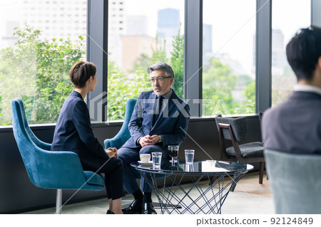 Business group talking in the lobby Business group talking in the lobby 92124849