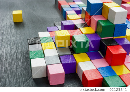 Lots of colorful cubes on the dark surface. Variety abstract concept. Lots of colorful cubes on the dark surface. Variety abstract concept. 92125841