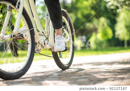 Close up of picture with a person on bike 92127187