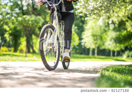 Close up of picture with a person on bike 92127188
