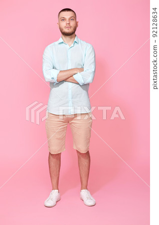 young caucasian man holding hands crossed looking camera 92128634