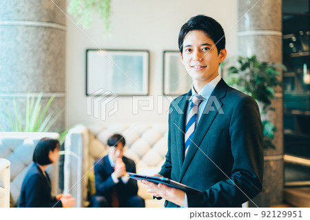 A businessman with a tablet 92129951
