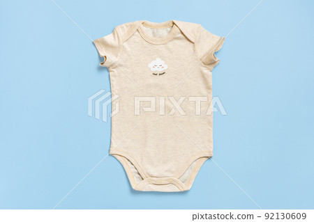 beautiful accessories - clothes for newborn, cotton isolated on blue background Copy space Concept of childhood, motherhood, fashion textile and newborn Top view Flat lay. beautiful accessories - clothes for newborn, cotton isolated on blue background Copy space Concept of childhood, motherhood, fashion textile and newborn Top view Flat lay. 92130609