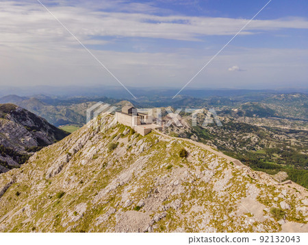 Montenegro. Lovcen National Park. Mausoleum of Negosh on Mount Lovcen. Drone. Aerial view. Viewpoint. Popular tourist attraction. Petar II Petrovic-Njegos mausoleum on the top of mount Lovchen in 92132043