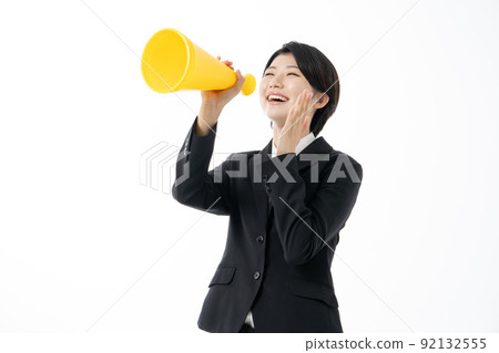 Female new employee screaming with a yellow megaphone on a white background Female new employee screaming with a yellow megaphone on a white background 92132555