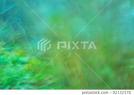 Green blurred bokeh background with motion effect. Green blurred bokeh background with motion effect. 92132578