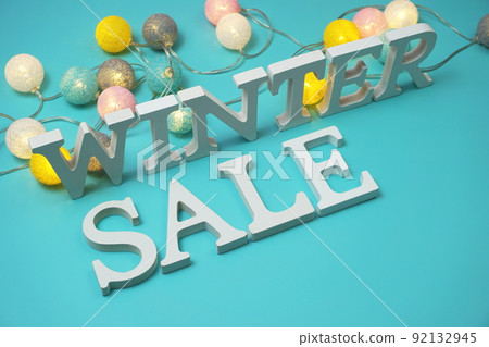 Winter Sale alphabet letters with LED cotton balls decoration on blue background Winter Sale alphabet letters with LED cotton balls decoration on blue background 92132945