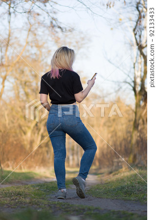 Beautiful woman in autumn landscape. Beautiful woman in autumn landscape. 92133433