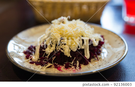 grated boiled beets with garlic, cheese and mayonnaise grated boiled beets with garlic, cheese and mayonnaise 92136003