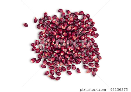 Purple corn or maize seeds isolated on white background with full depth of field. Top view. Flat lay 92136275