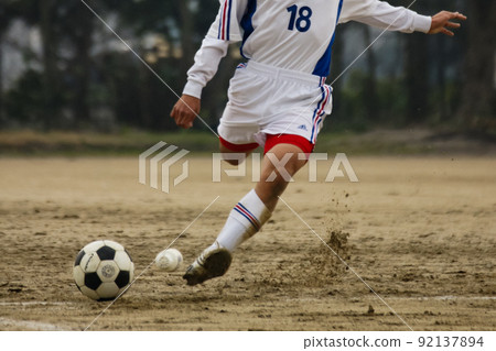 Hit a shot in soccer 92137894