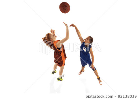 Aerial view of female basketball players, young girls, teen playing basketball isolated on white background. Concept of sport, team, enegry, competition, skills Aerial view of female basketball players, young girls, teen playing basketball isolated on white background. Concept of sport, team, enegry, competition, skills 92138039