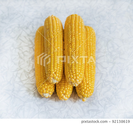 pile of corn cobs on a light background, vegetables stacked pile pile of corn cobs on a light background, vegetables stacked pile 92138619