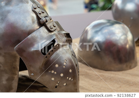forged iron helmet with visor close up .traditional warrior protection forged iron helmet with visor close up .traditional warrior protection 92138627