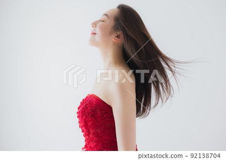 Woman in a red dress 92138704