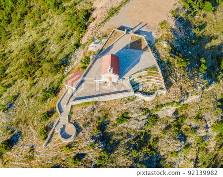 The Church of St. Sava in Montenegro, near the island of Sveti Stefan near Budwa. Drone view. Location: church St. Sava, Montenegro, Balkans, Adriatic sea, Europe 92139982