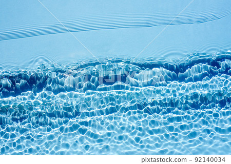 Background, texture of transparent blue water with seething ripples , waves 92140034