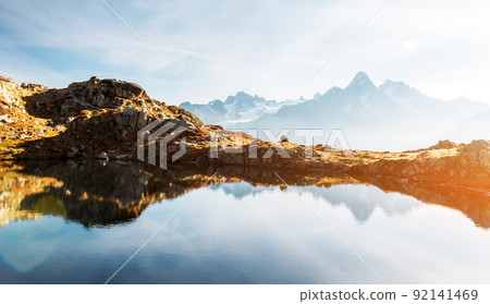 Colourful sunset on Chesery lake in France Alps Colourful sunset on Chesery lake in France Alps 92141469
