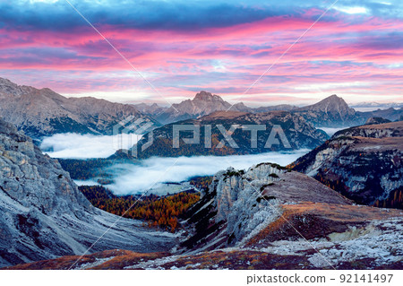 Incredible panoramical view in the foggy morning Dolomites mountains Incredible panoramical view in the foggy morning Dolomites mountains 92141497