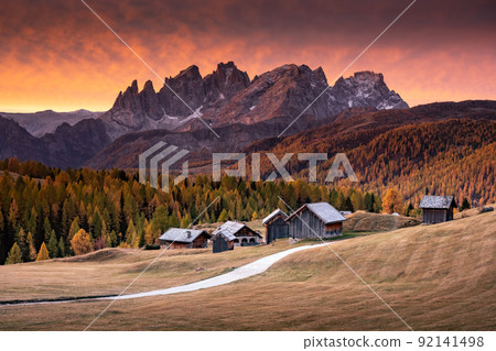 Incredible red sunset at Fuchiade valley in Italian Dolomites countryside 92141498