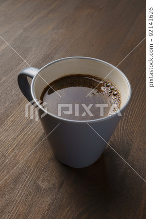 cup of natural coffee on wooden table cup of natural coffee on wooden table 92141626