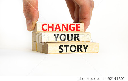 Change your story symbol. Concept words Change your story on wooden blocks on a beautiful white table white background. Businessman hand. Business finacial and change your story concept. Copy space. 92141801