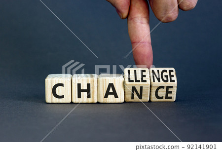 Chance or challenge symbol. Businessman turns wooden cubes and changes the concept word challenge to chance. Beautiful grey table grey background. Business challenge or chance concept. Copy space. Chance or challenge symbol. Businessman turns wooden cubes and changes the concept word challenge to chance. Beautiful grey table grey background. Business challenge or chance concept. Copy space. 92141901