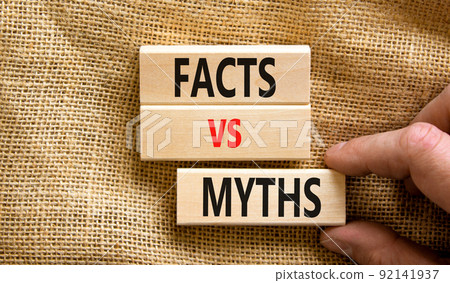Facts vs myths symbol. Concept words Facts vs myths on wooden blocks on a beautiful canvas table canvas background. Businessman hand. Business, finacial and facts vs myths concept. Copy space. 92141937