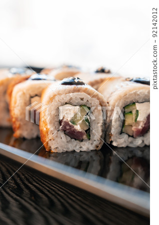 Sushi Rolls California with shrimp, eel, sesame. Sushi Rolls California with shrimp, eel, sesame. 92142012