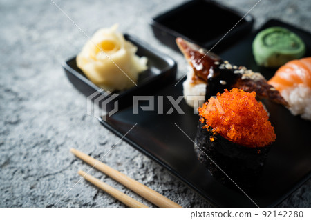 Selection of sushi on rustic background, copy space Selection of sushi on rustic background, copy space 92142280