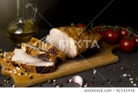 Pieces of baked pork and spices, close up. 92142438