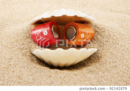 image of battery seashell sand background image of battery seashell sand background 92142879