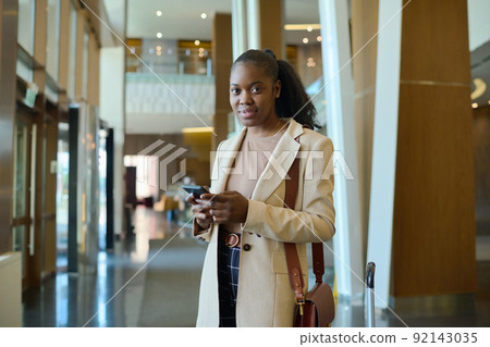 Young African American woman in smart casualwear looking at camera 92143035