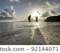 Young people jumping in the sea 92144071