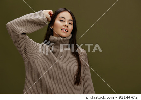 woman in a sweater posing smile clothing fashion isolated background 92144472