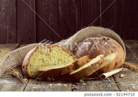 baked bread on wooden table background baked bread on wooden table background 92144710