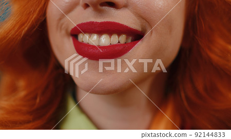 Portrait close-up of young happy redhead woman smile mouth, red lipstick, female model smiles wide 92144833