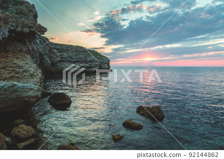 Brilliant vacation destination beach sunrise and sea cliffs background 92144862