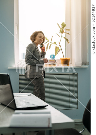 Young professionals, gen z working, first job. Confident young businesswoman working 92144937