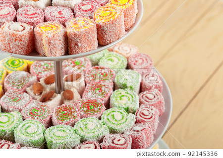 Turkish delight on a wooden table. 92145336
