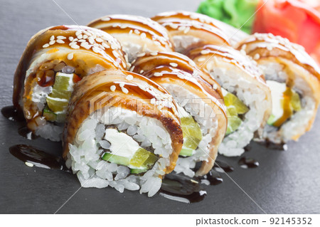 Japanese restaurant, sushi roll on black slate plate. Japanese restaurant, sushi roll on black slate plate. 92145352