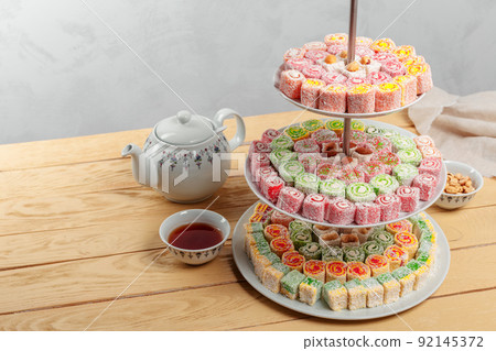Turkish delight on a wooden table. 92145372