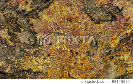 The texture of stone wall corrosion or grunge stone texture use for web design and wallpaper background. Surface of ancient rock layers brown, yellow, red The texture of stone wall corrosion or grunge stone texture use for web design and wallpaper background. Surface of ancient rock layers brown, yellow, red 92145634