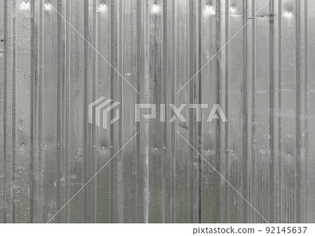 The texture of the fence made of green profiled sheet. Background. Space for text. 92145637
