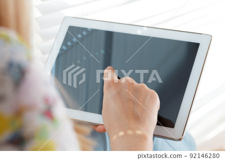 woman holding digital tablet, closeup 92146280